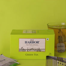 Load image into Gallery viewer, Old Harbor Green Tea is handpicked from selected gardens, our Pure Green Tea is a non-bitter refreshing drink.  Do take a moment to enjoy this soothing blend.  Best consumed without milk &amp; sweeteners.  Pure green tea has less than one calorie. Natural and distinctive. Staple-free tea bags and microwavable. Each tea bag is individually enveloped.

