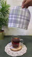 Load and play video in Gallery viewer, Old Harbor Tea Gift Hamper (mint green tea+tea cozy+tea bag squeezer)
